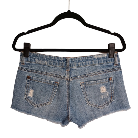 SOMETHING TRICKIE FREE THE REVOLUTION Light Wash Distressed Mini Raw Hem Shorts - Picture 2 of 5